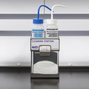 Cleaning station for laboratory safety enclosures with wipes, solvent wash and water bottle